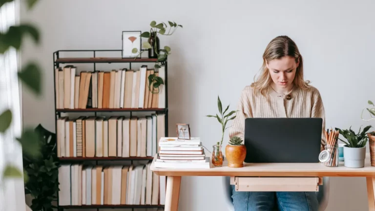 Accountant at a home desk with a laptop, set up for secure remote working